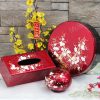 Bộ quà tặng Hộp mứt sơn mài Tết đào trắng đắp nổi nền đỏ đô
